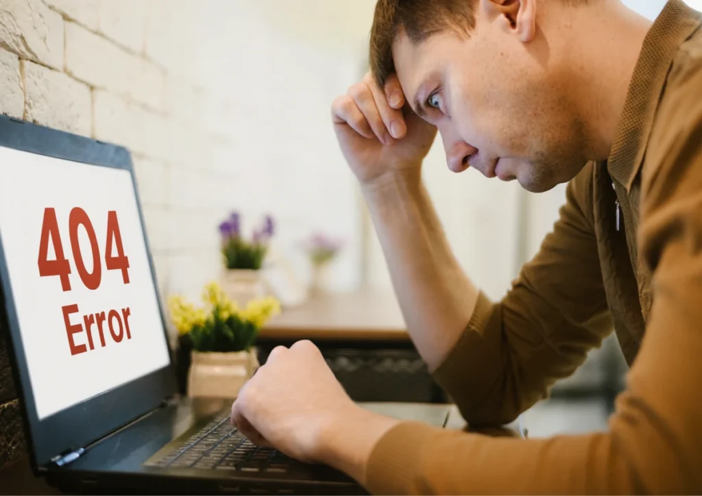 a man frustrated at laptop screen showing error page with no Free Time Card Calculator