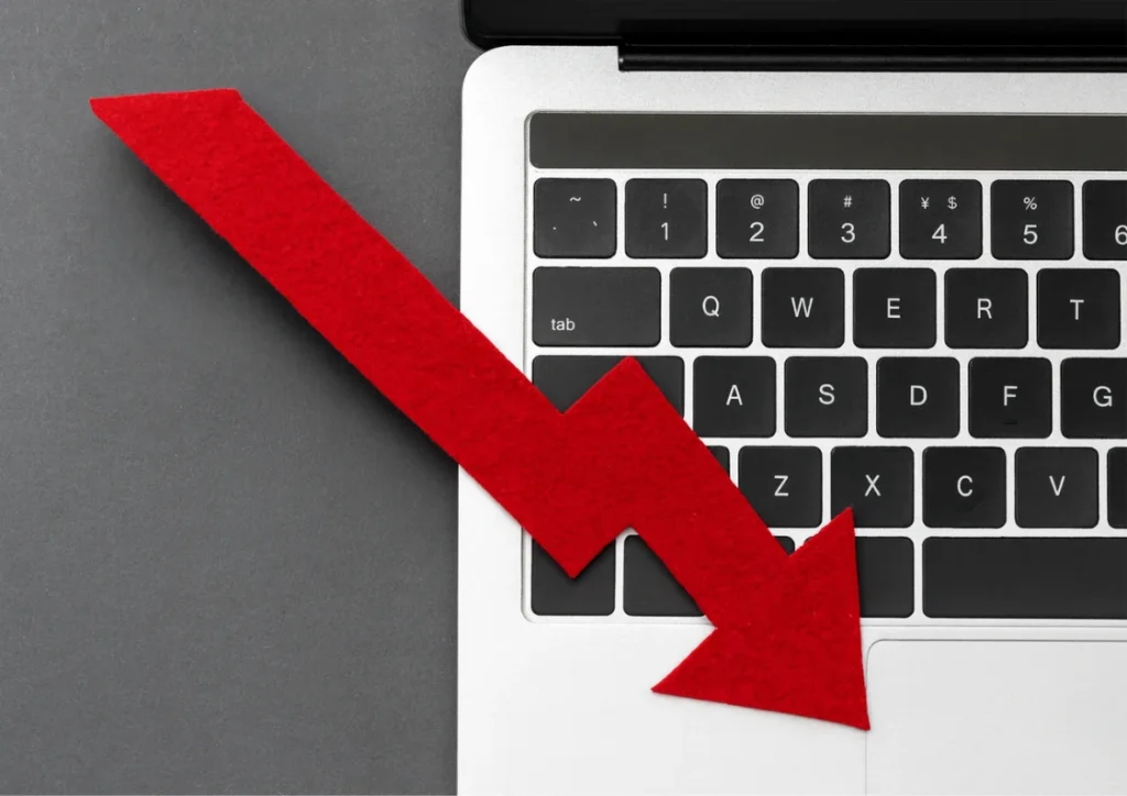 an arrow in front of laptop that shows sales going down with no Time Clock Software