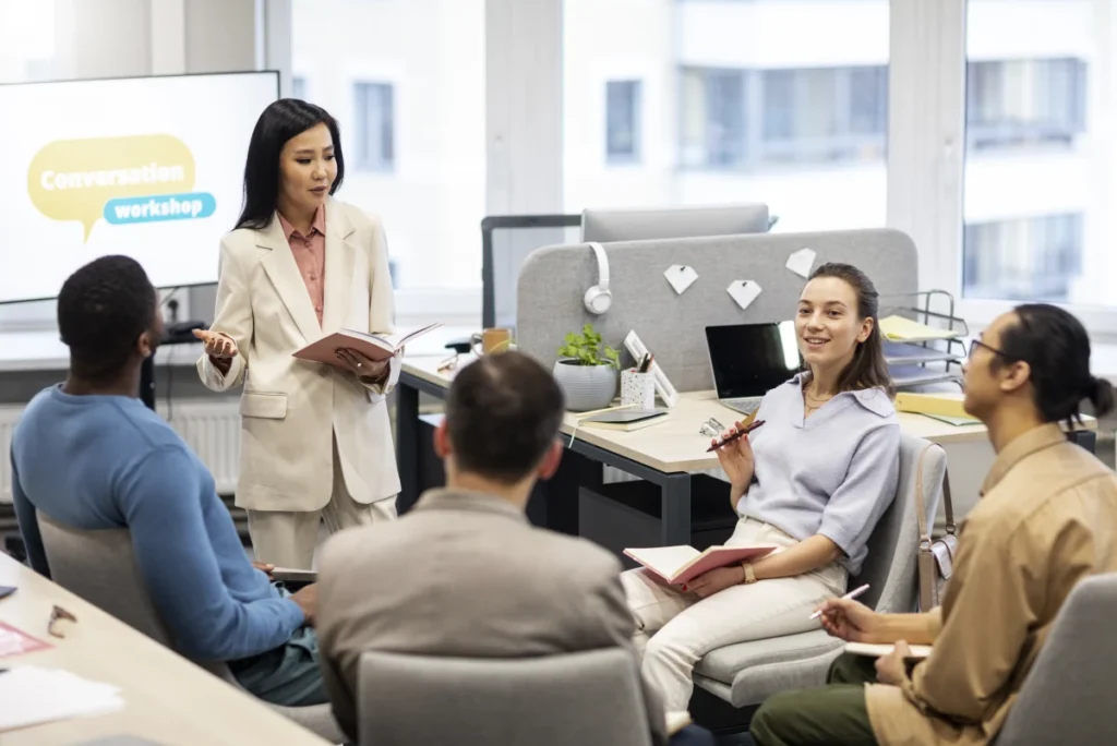 employees doing a brainstorming meeting with Free Time Tracking Software
