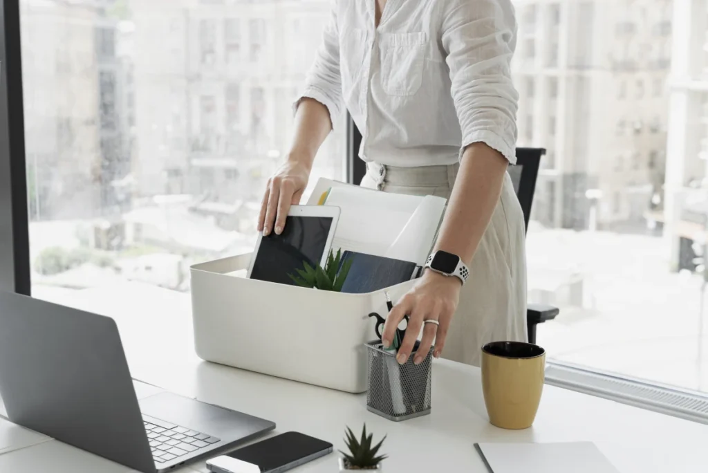 female employee packing office supplies for not using Best Time Clock Software