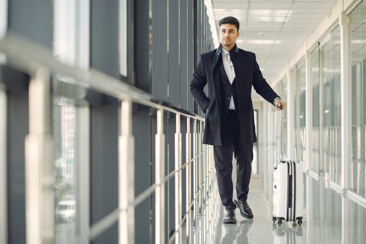 business man carrying suitcase that tracks work with Time Sheet Software