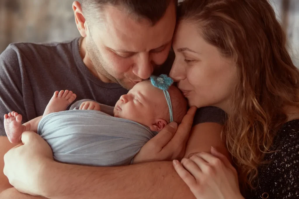 family who uses Employee Time Clock Software welcoming newborn child