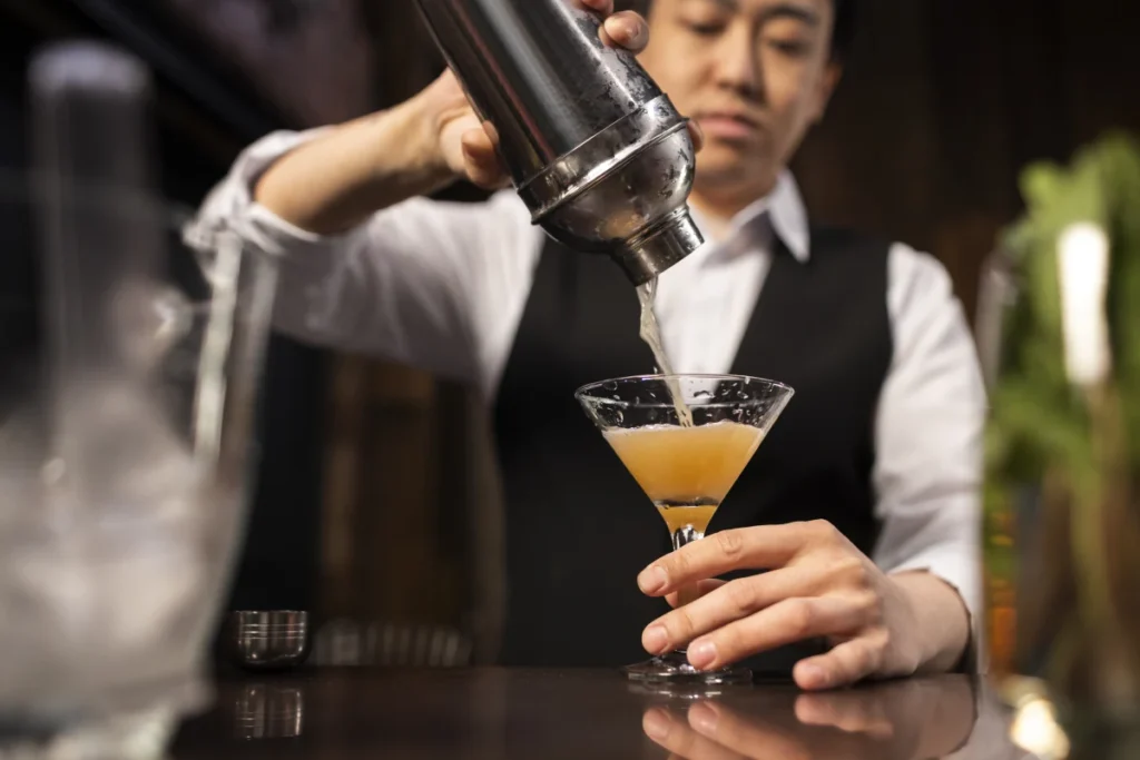 bartender who is working for tipped minimum wage with the help of Time Sheet Software to track his hours