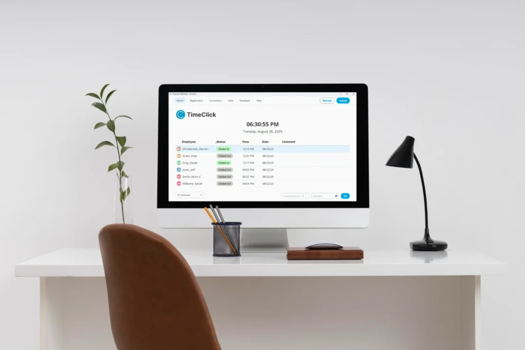 Desktop time clock software running on an office computer used by employees to clock in and out