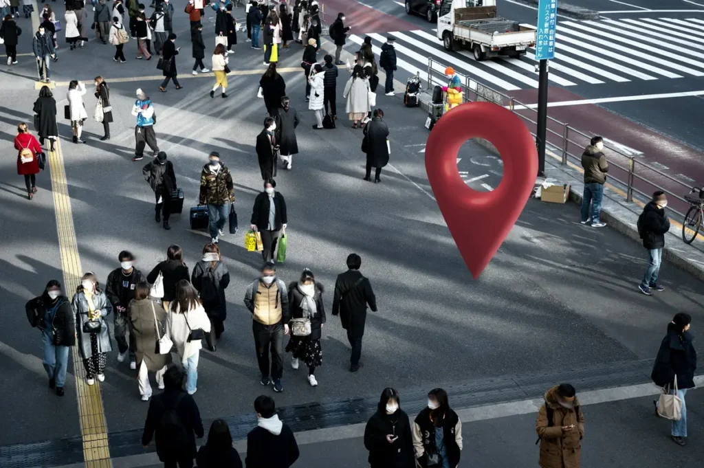 Location pin over busy street representing GPS based employee time tracking for mobile workers