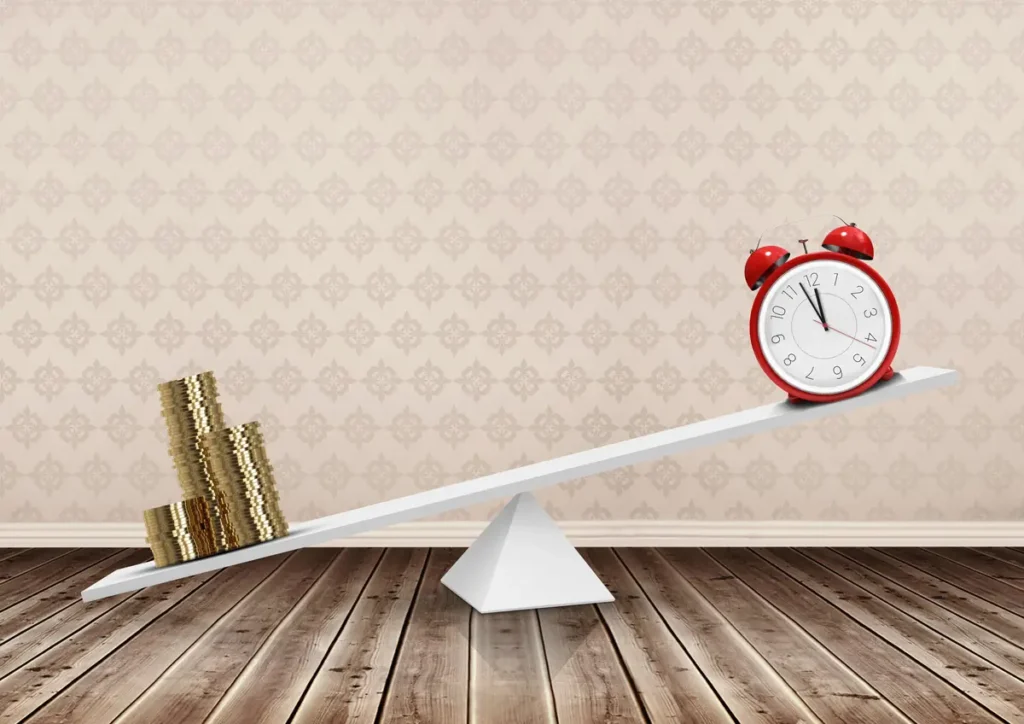 Balance scale showing money and a clock, representing labor costs and time tracking accuracy as a business grows
