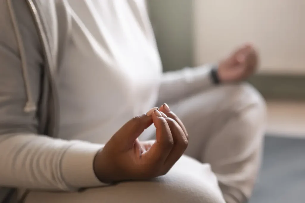 Employee practicing mindfulness to reduce stress and improve focus and productivity at work
