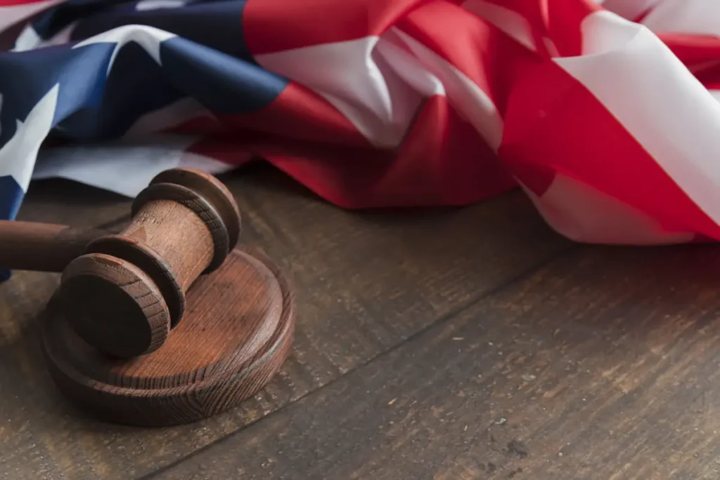 Gavel and American flag symbolizing US labor law and employee time record compliance