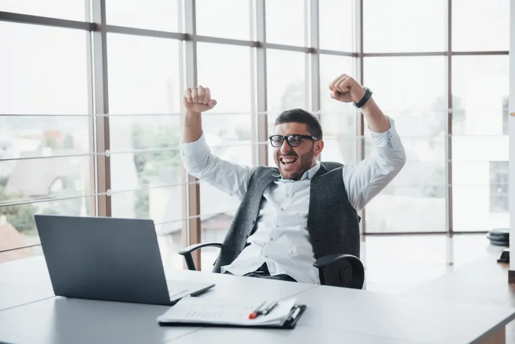 Business owner celebrating accurate overtime calculation and payroll processing success