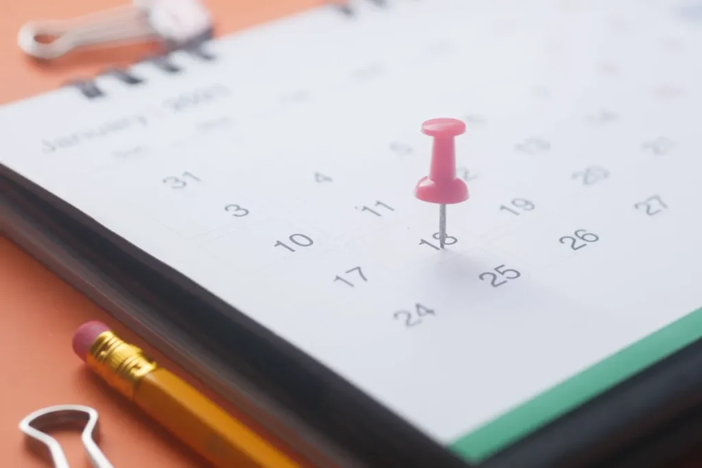 Calendar page with a red pin marking a holiday