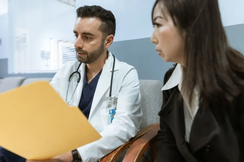 Doctor going over paperwork with a patient