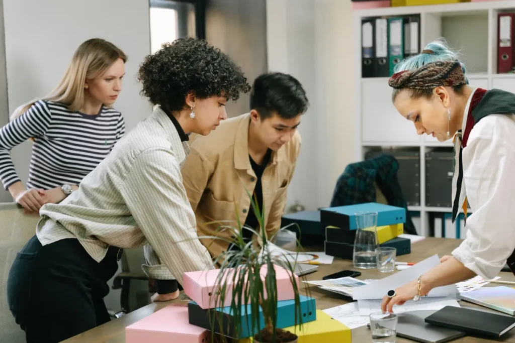 Small team meeting around a table during a workplace training